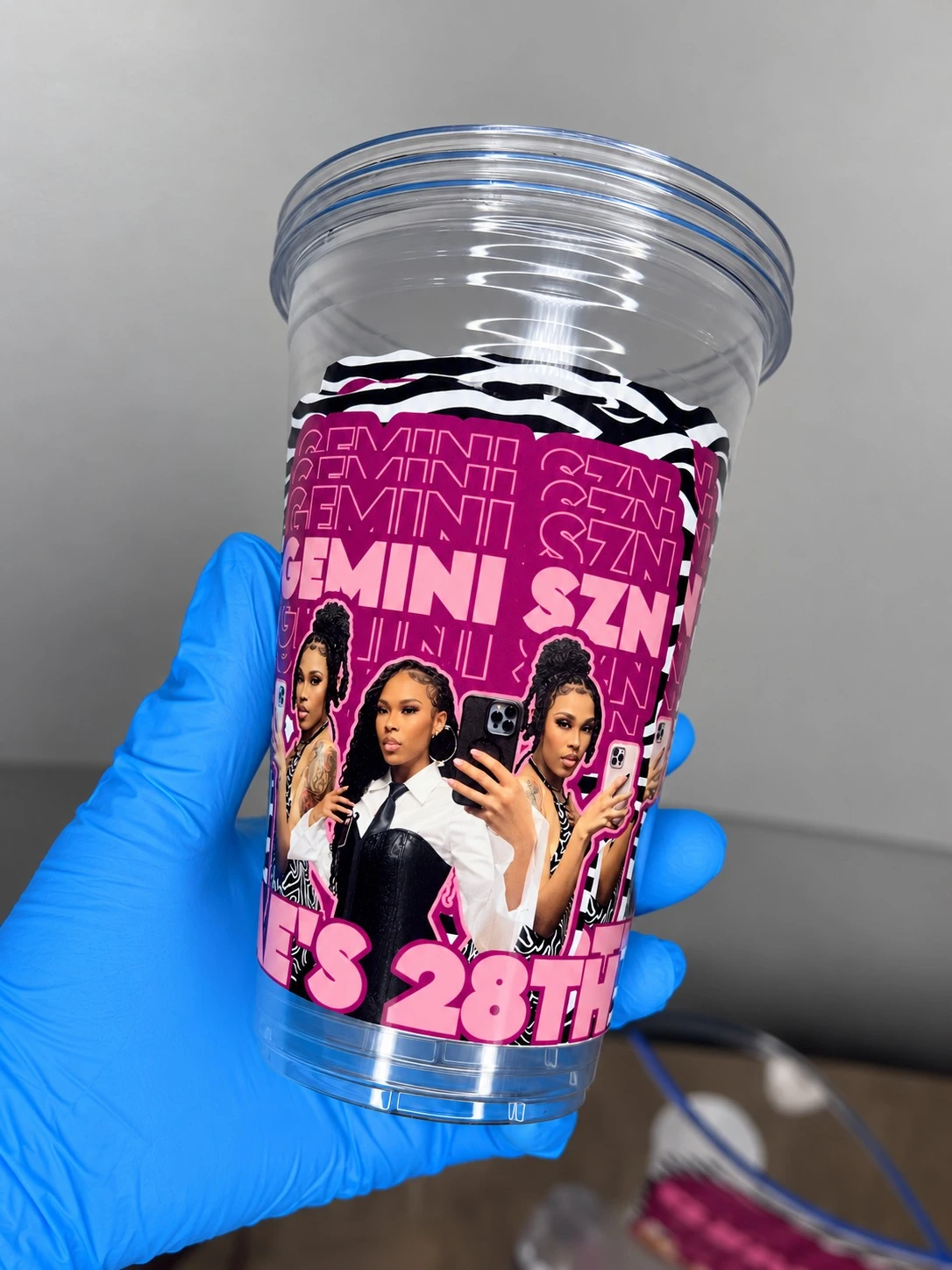 Close-up of pink Gemini birthday cup